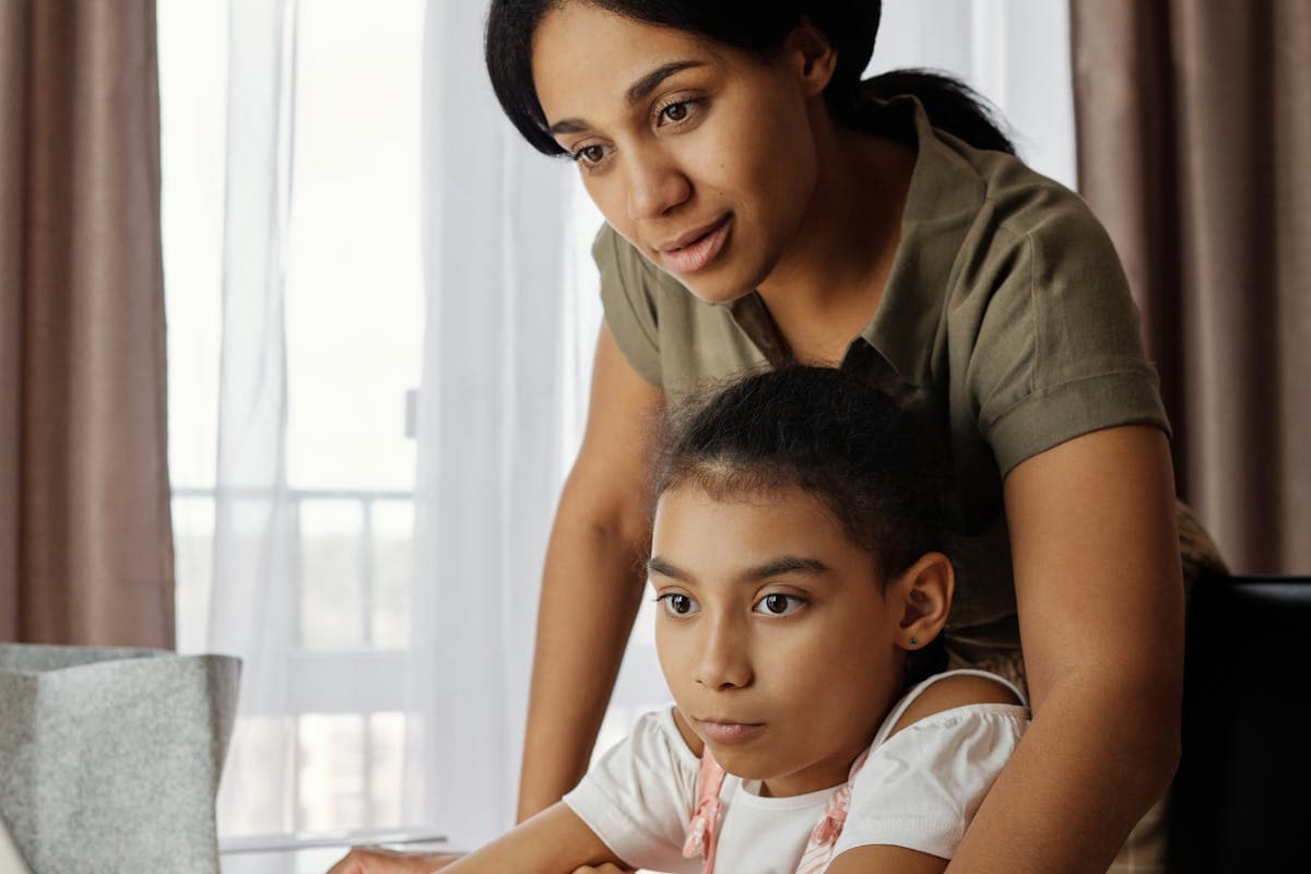 Clinician and parent supporting a young child during a warm developmental moment